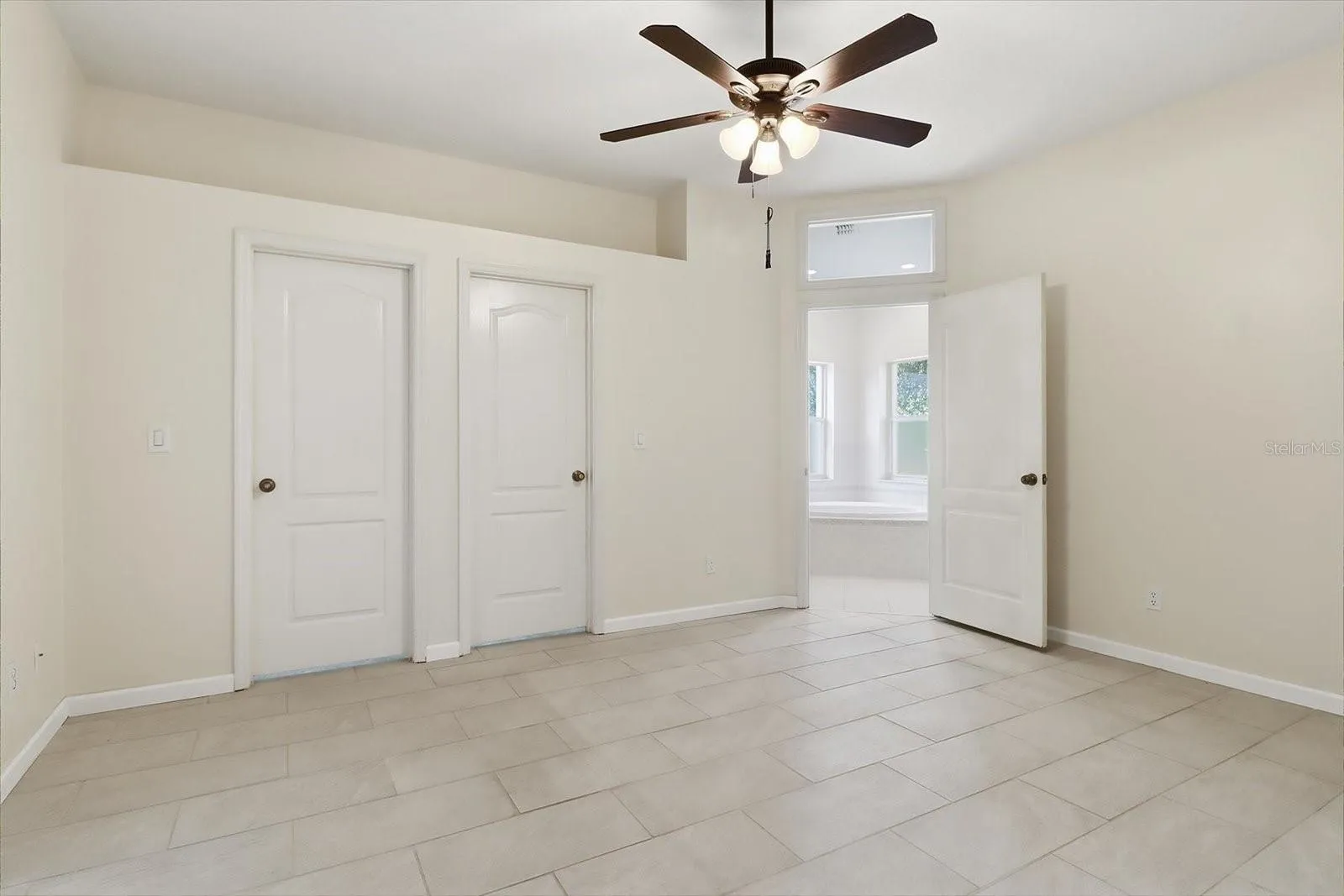 Master Bedroom w/ Slider to the Sunroom, Dual Walk in Closets, Plant Shelf & Ensuite