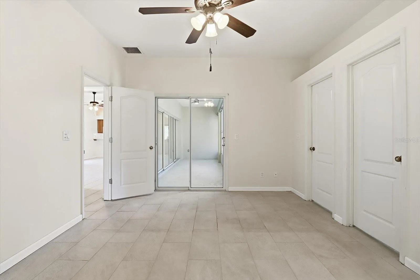 Master Bedroom w/ Slider to the Sunroom, Dual Walk in Closets, Plant Shelf & Ensuite w/ Dual Sinks, Linen Closet, Separate Soak Tub & Tiled Shower