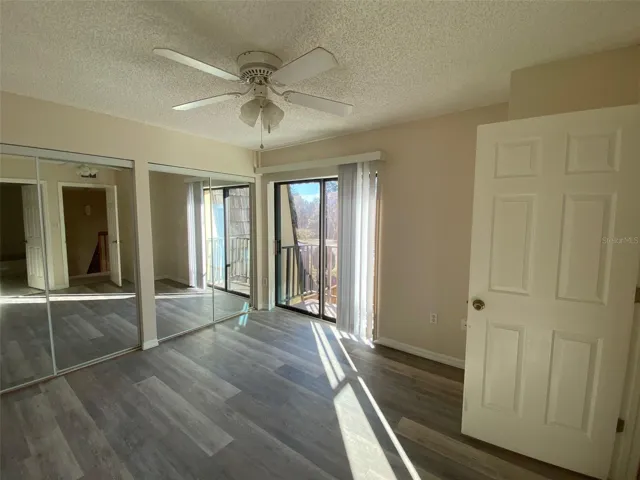 This bedroom has double mirrored closet and balcony overlooking courtyard