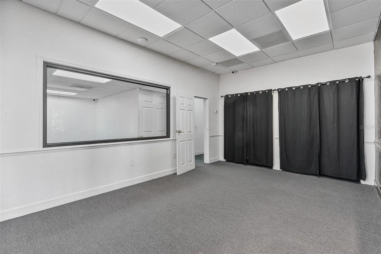 Reception area and entry to conference room, 3 offices and warehouse.
