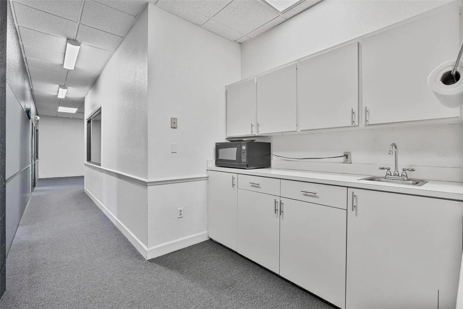 Breakroom area located at the end of the hallway on Right side.