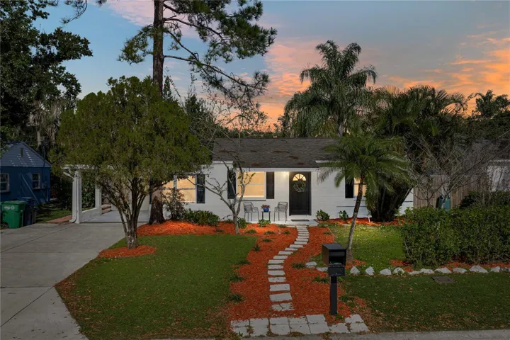 Exterior Night Front Shot with 1 Car Carport and Double Wide Driveway