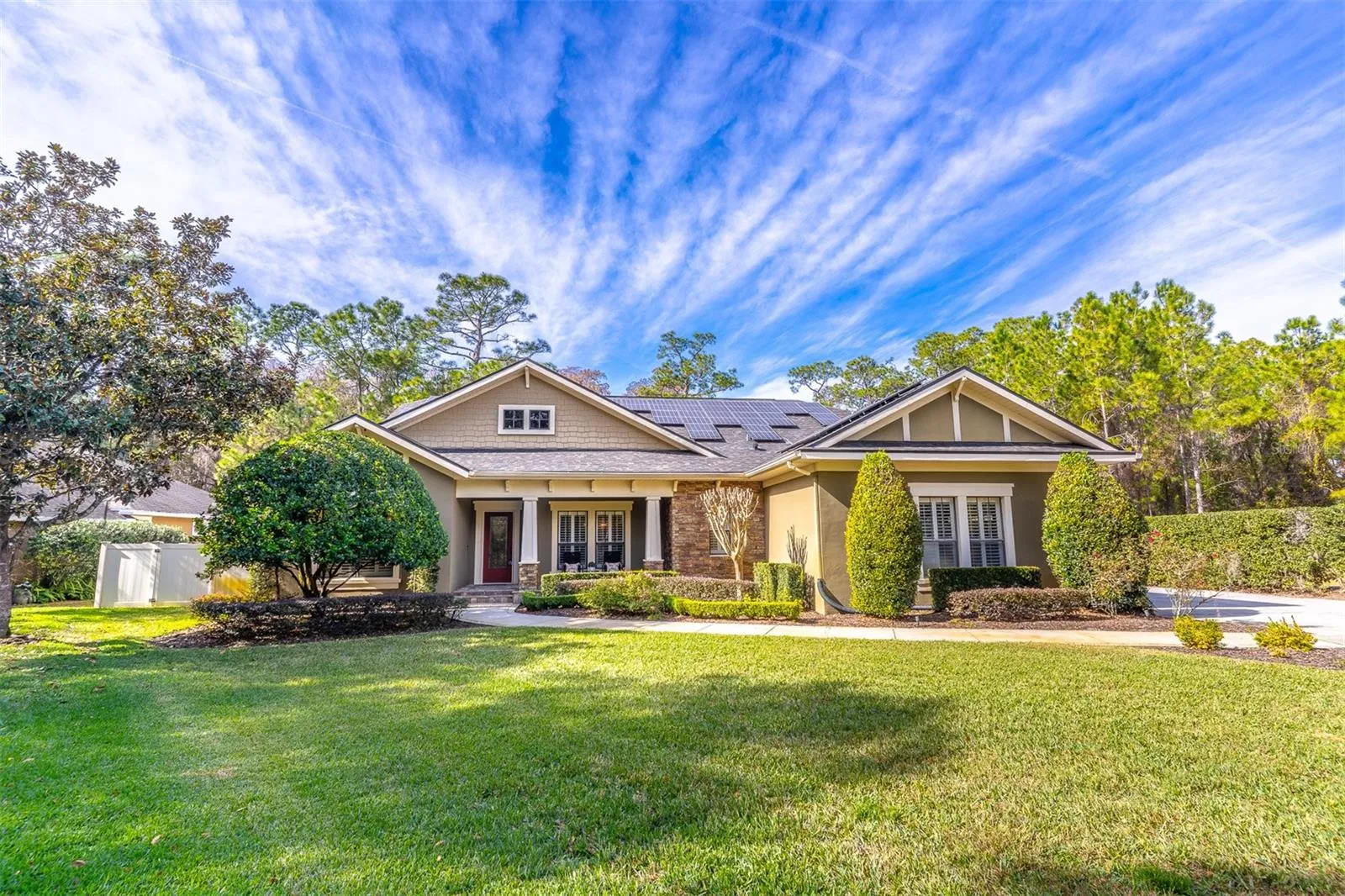 Lakefront elegance on a private lot with room to entertain.