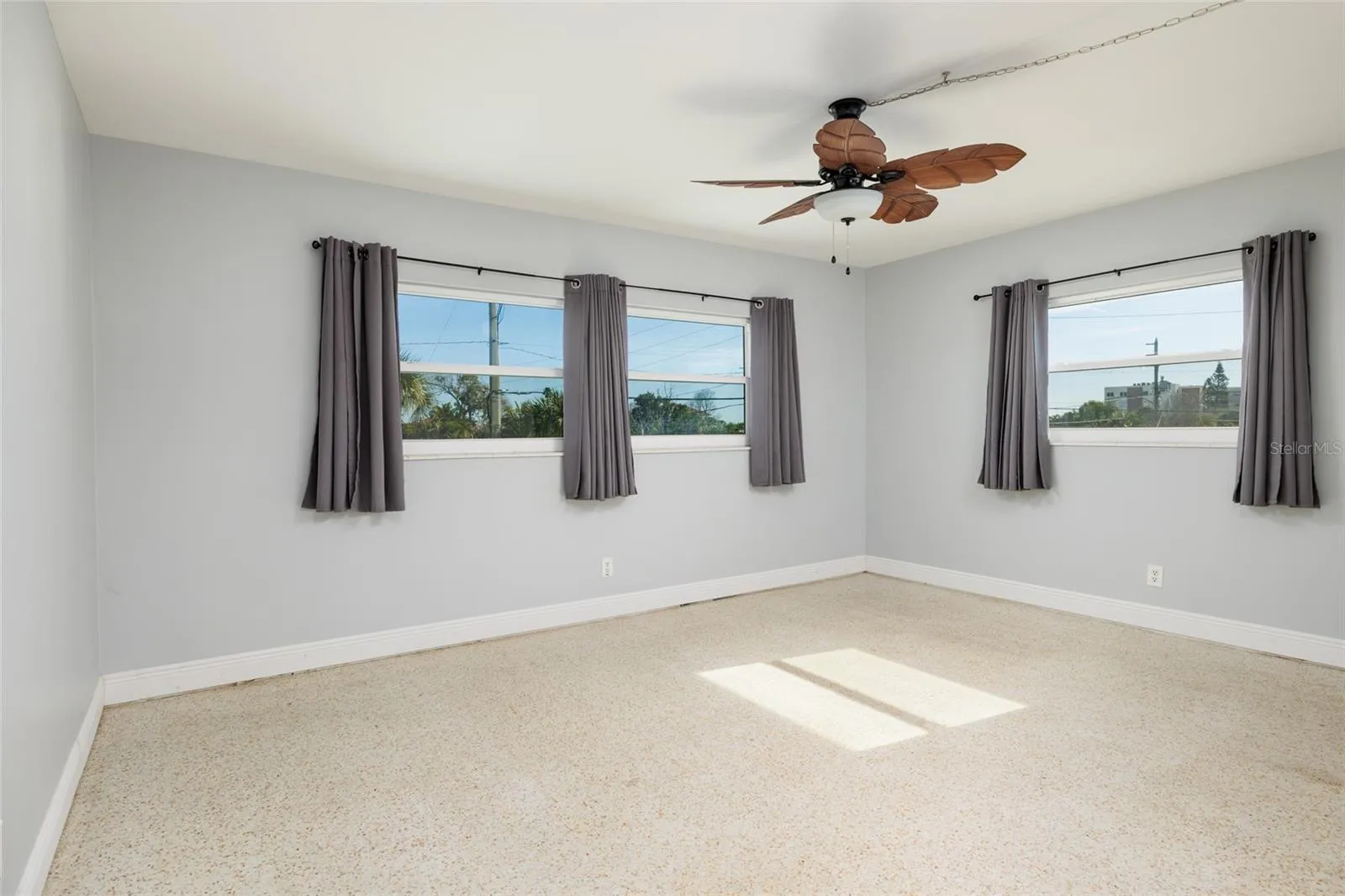 Front primary bedroom (16'x12') w/Hurricane impact double pane windows. Split bedrooms. En-suite bathroom &amp; walk-in closet.