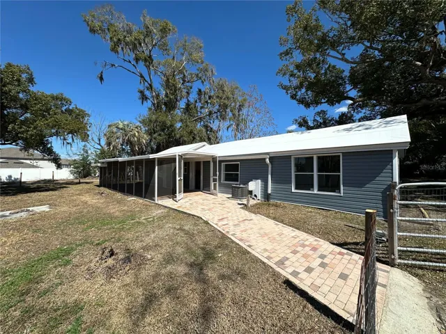 Paver walkway and large screened patio