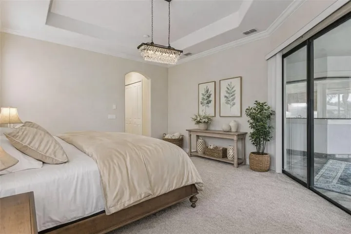 A serene primary suite retreat—complete with a private hallway leading to double closets and a spacious ensuite bath for the ultimate everyday luxury.