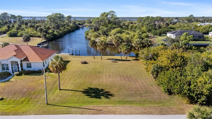 Featuring a seawall and added fill for elevation, it offers easy access to boating, fishing, and kayaking—perfect for outdoor living.