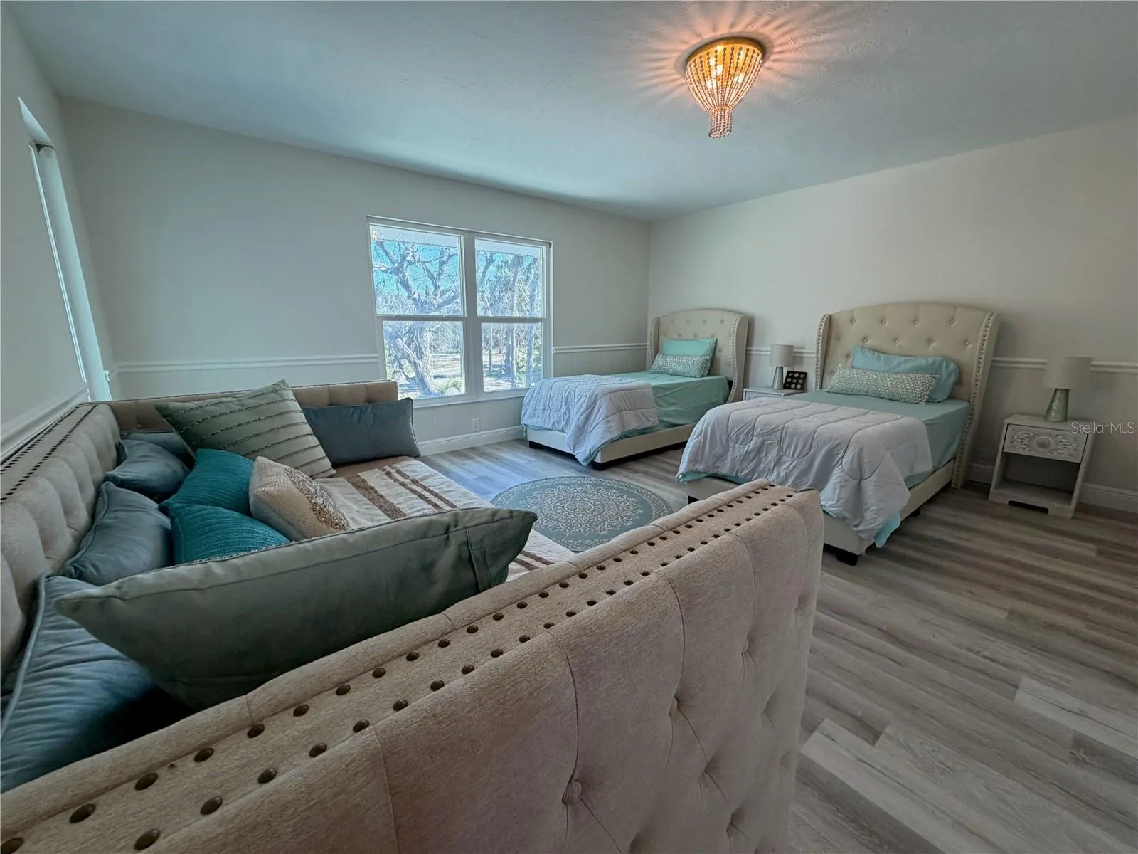 Guest bedroom with flexible layout and natural light.