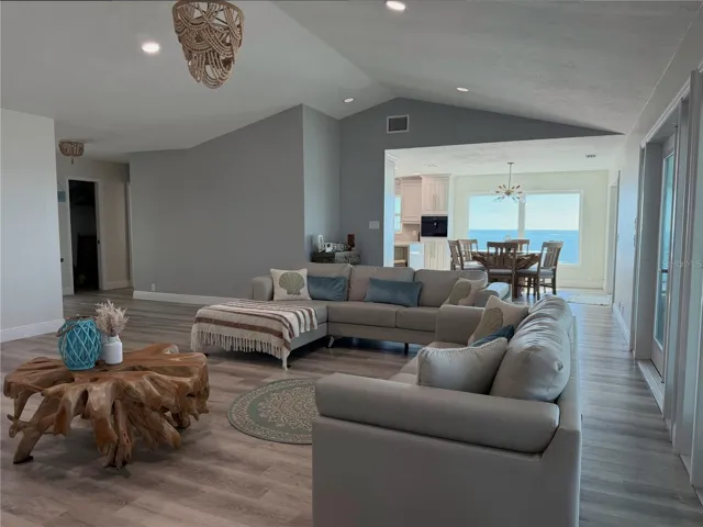 Open great room with vaulted ceilings and expansive Gulf views.
