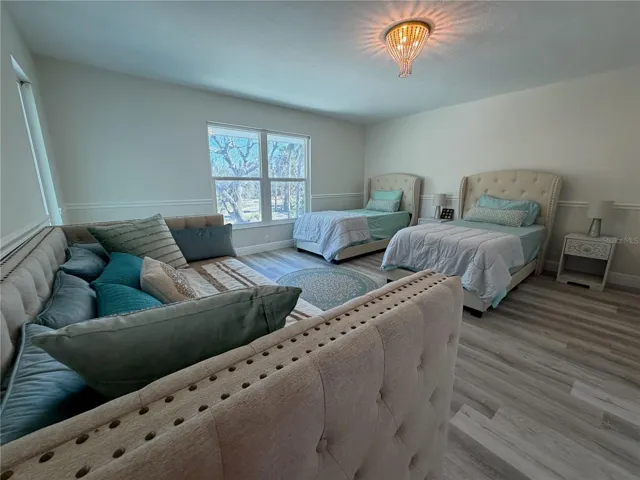 Guest bedroom with flexible layout and natural light.
