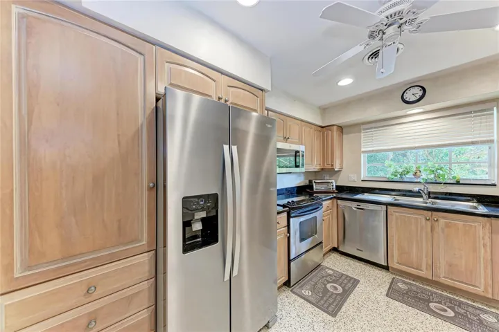 kitchen-wood cabinetry and pullouts in pantry cabinet