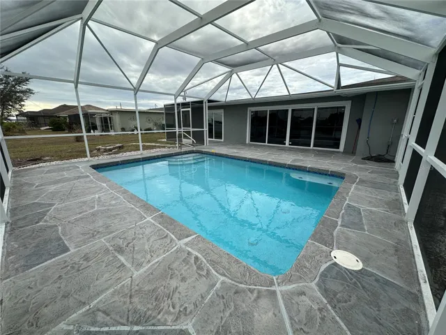 Decorator pool deck with room for a wide variety of furniture.