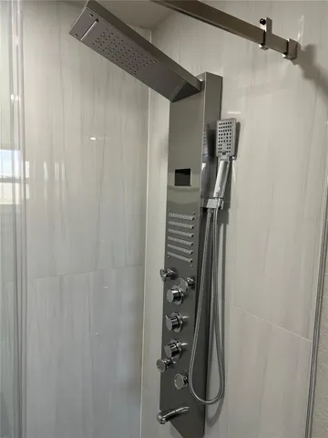 Each shower features this head that offers 6 different sprays and has a digital water temperature read-out.
