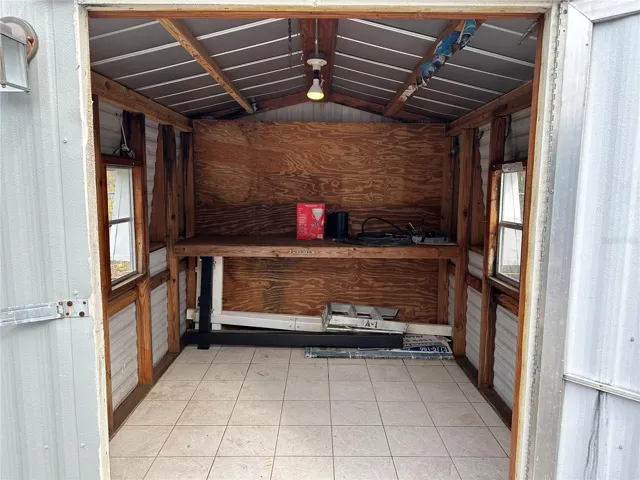 Interior of the shed - work bench and electric.