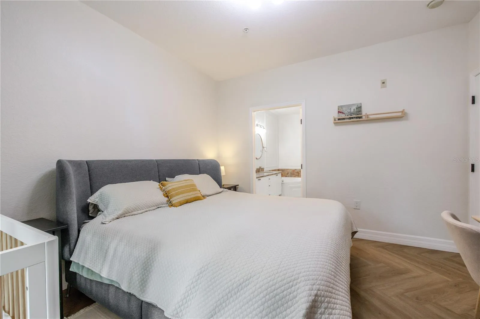 The primary bedroom with ensuite bathroom.