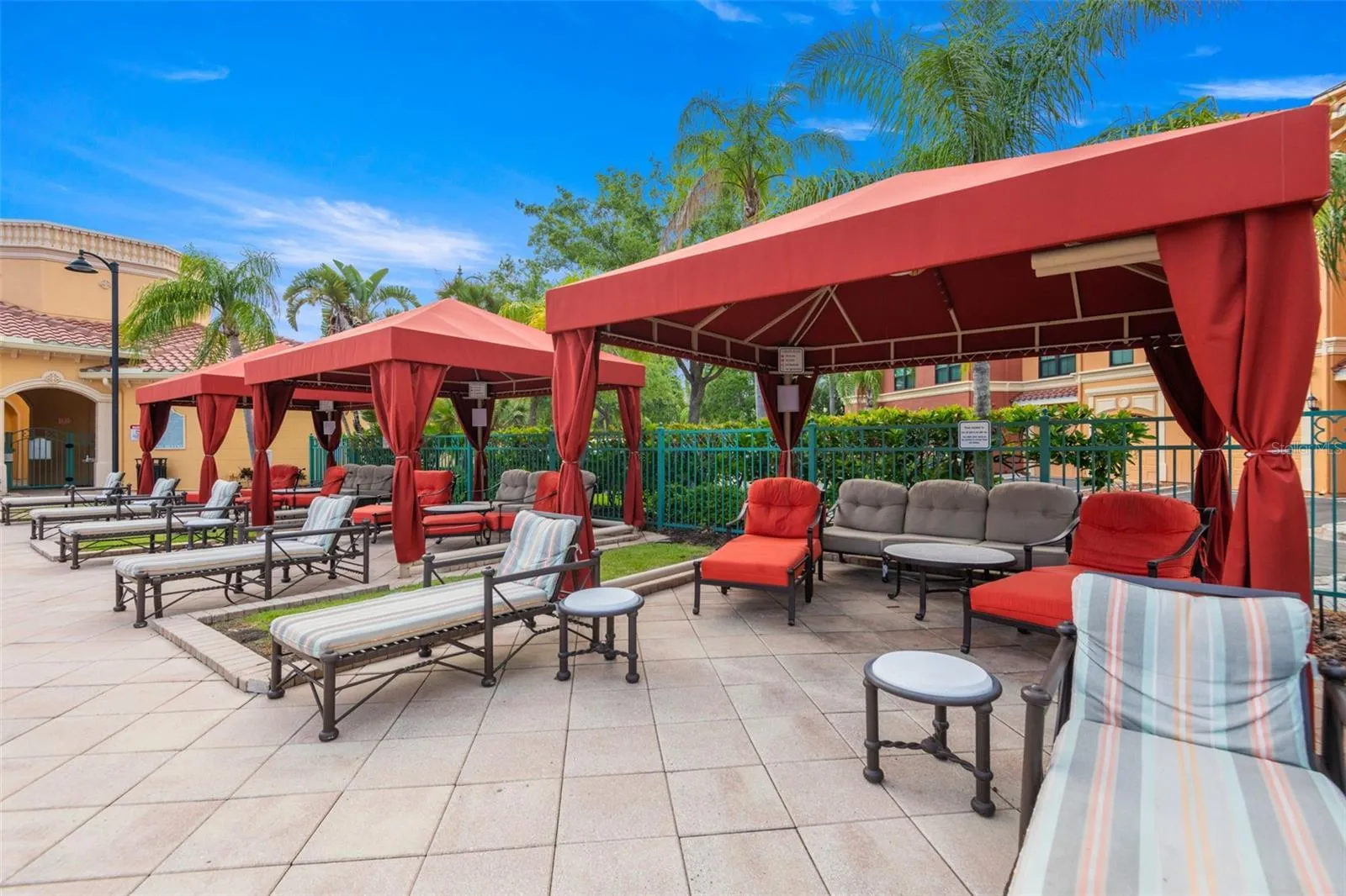 Resort style cabana seating in the pool area.