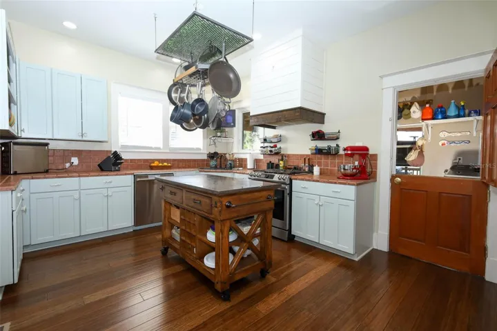 Kitchen w/gas range & dutch door to laundry room.