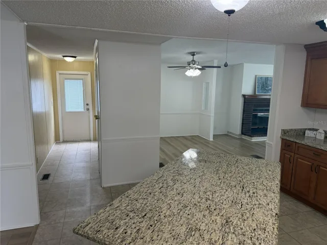 Kitchen facing living room/ laundry hall