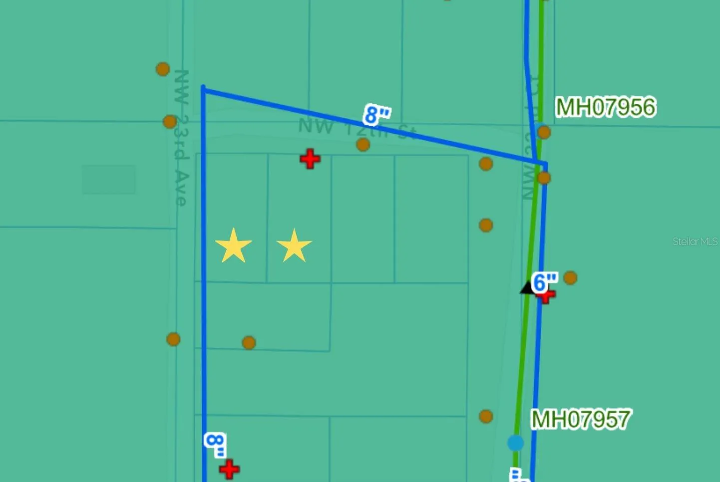 Utility map: yellow star is the vacant lots, red plus sign is a fire hydrant, orange circle is power poles