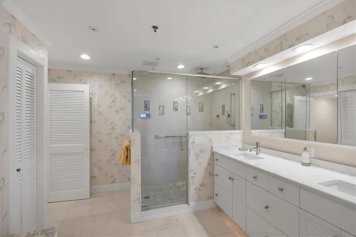 Master Bath has a custom shower with temperature control, accent lighting,  rain shower & extra jets