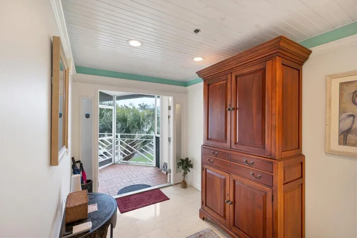 Front porch & double door entrance into foyer