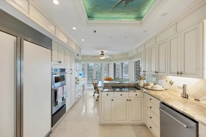 Kitchen features a sub zero refrigerator, newer convection oven and warming drawer