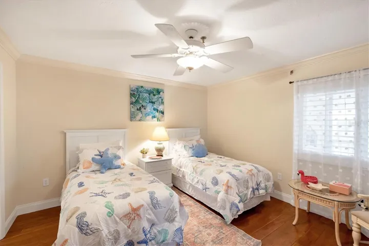 2nd Bedroom (en suite) features wood flooring and has it's own private bath