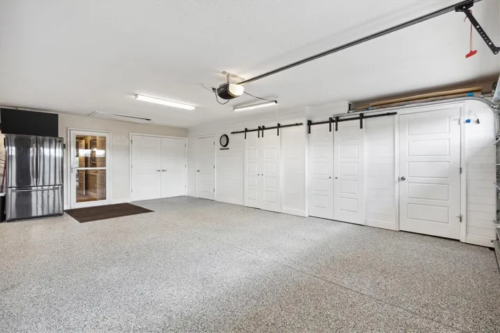 SHIPLAP WALLS AND EXTRA STORAGE BEHIND THE BARN DOORS