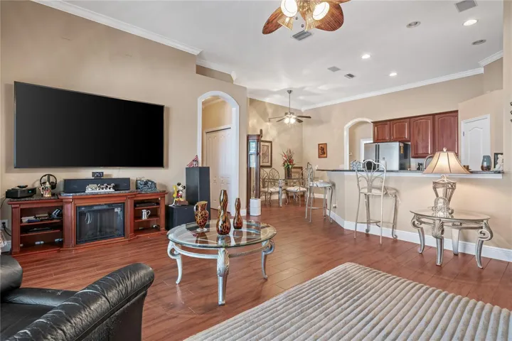 Living room with view of kitchen area