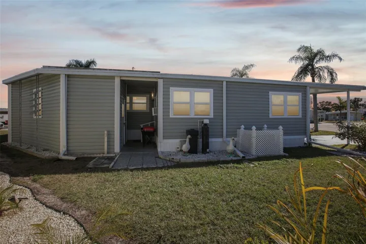 Virtually edited rear exterior of property showing rain gutters.