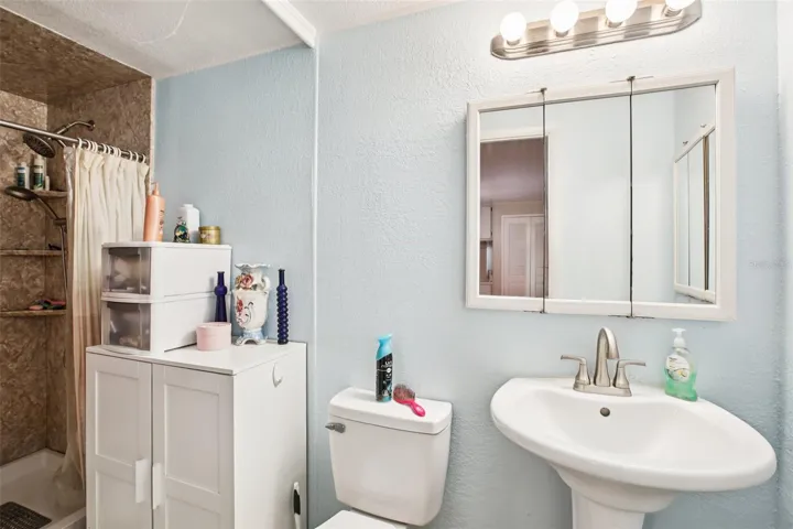 Primary bathroom showing walk-in shower.