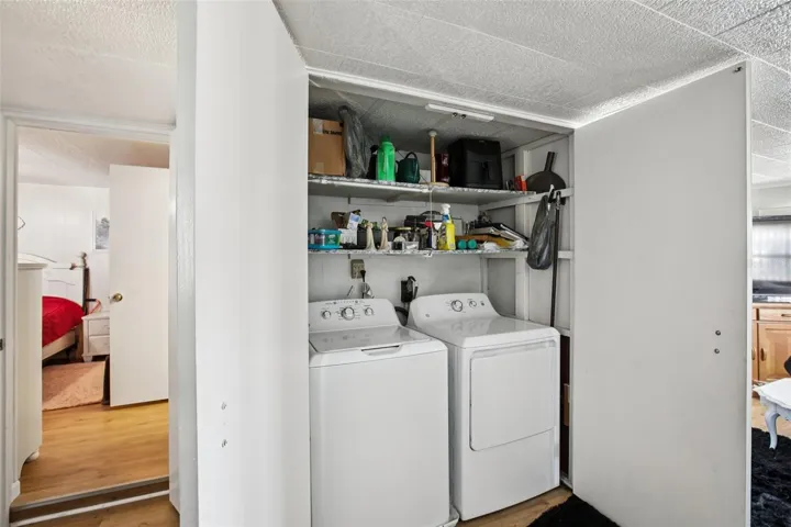 Laundry room facing primary bedroom.