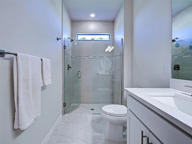 Walk-in shower with glass door