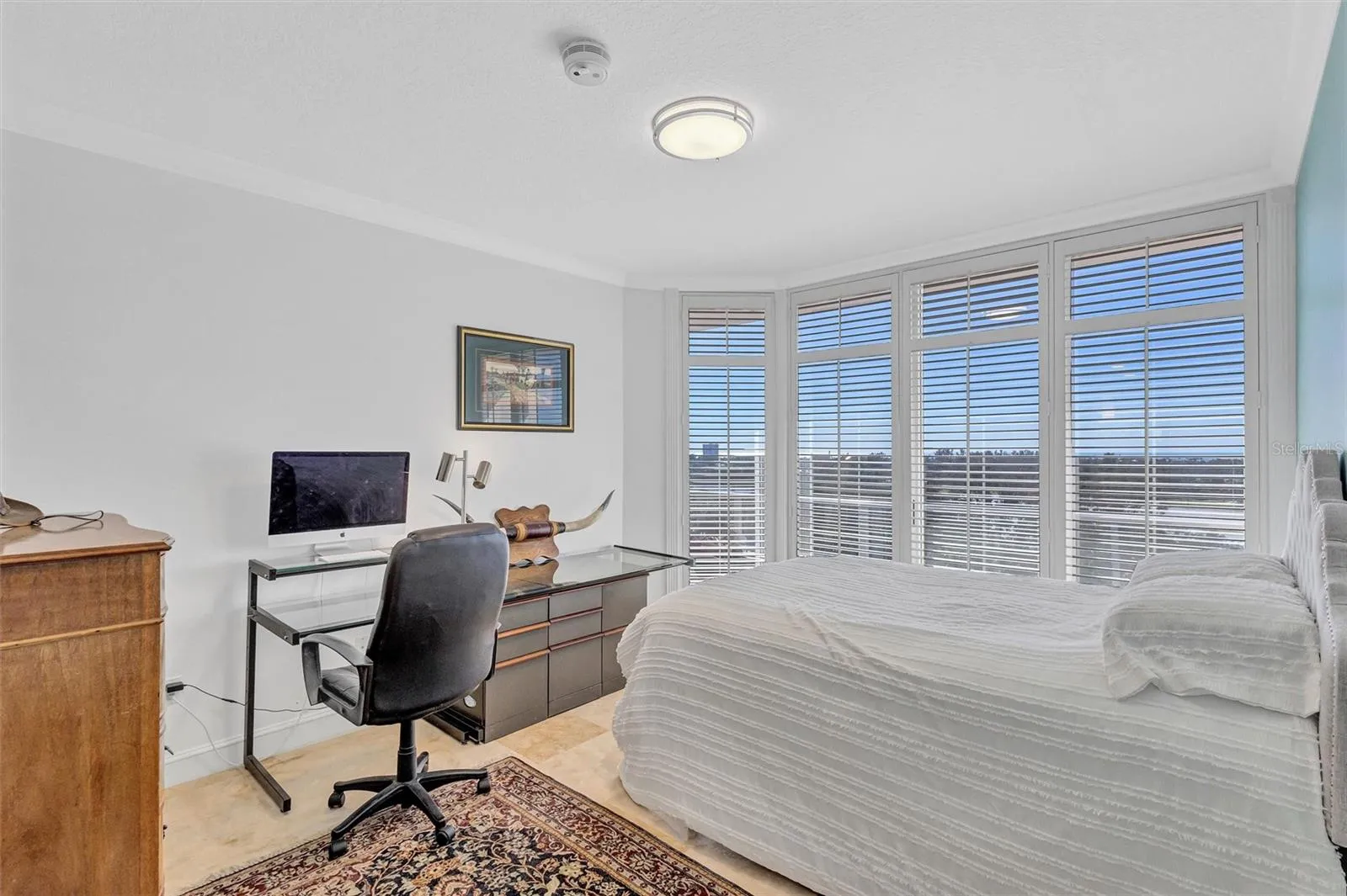Residence Secondary / Guest Bedroom with access to the Westerly Balcony.  Large Closet, with Large Walk in Shower, Storage and Bathroom. Polished Travertine Floors