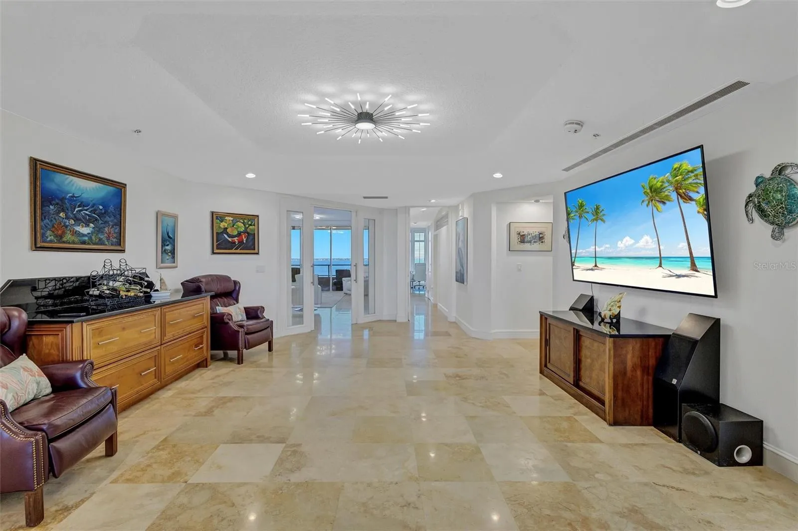 Sliding glass panels, separate living room from TV/den area