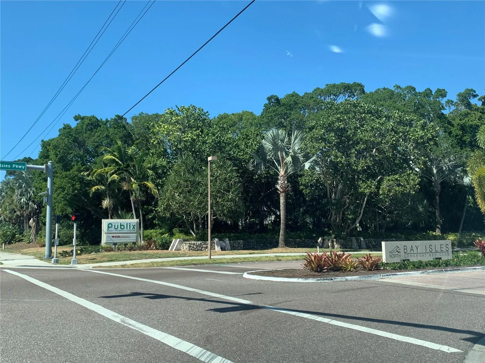 Bay Isles Grand Entrance from Gulf of Mexico Drive to Shopping, Golf Club and Bay Isles Community. Publix and CVS anchor a convenient shopping center within the Bay aisles communityPublix in CVS anchor this shopping center