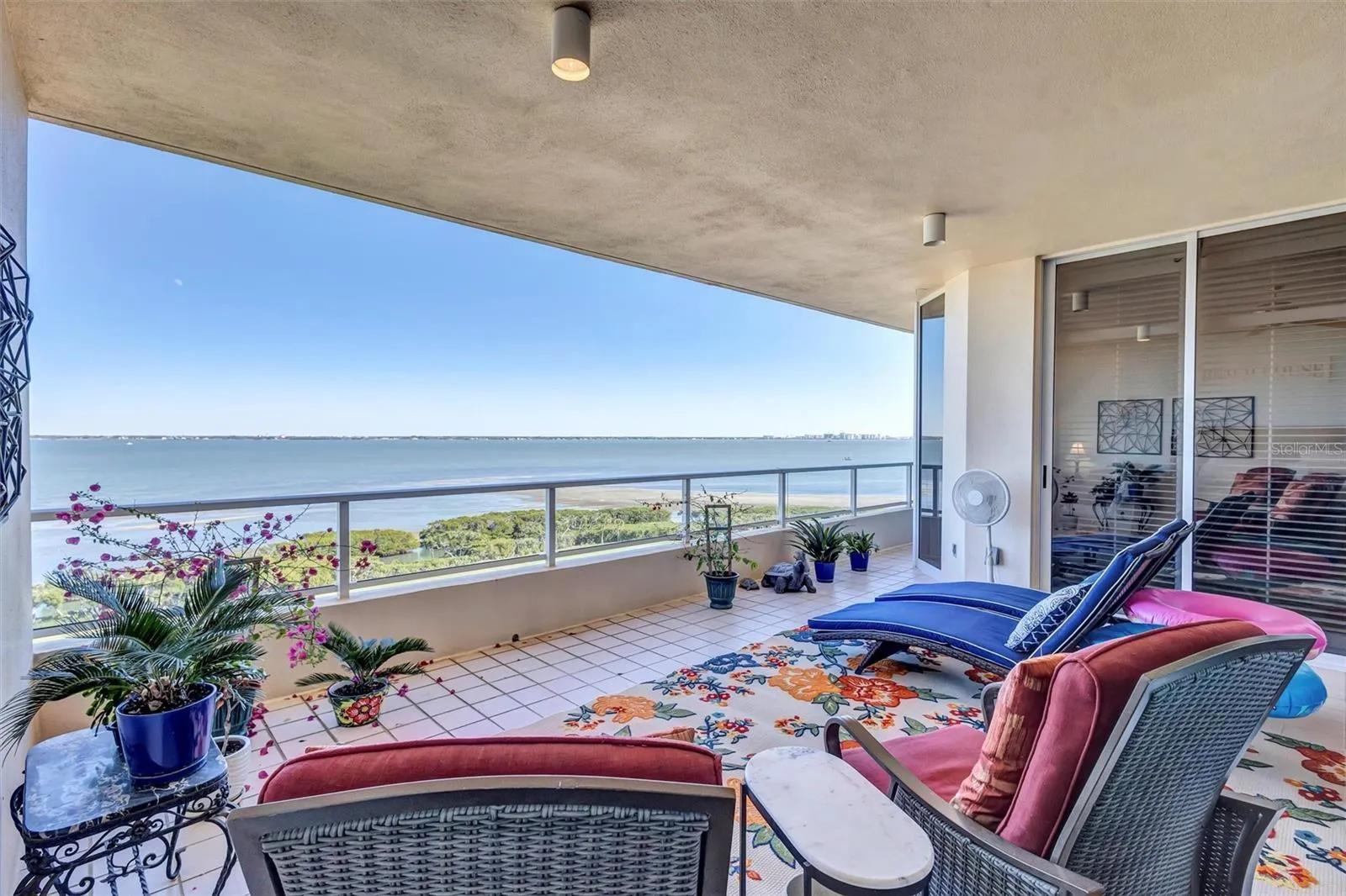 Residence Large tiled Patio Bay Views. Living Room and primar