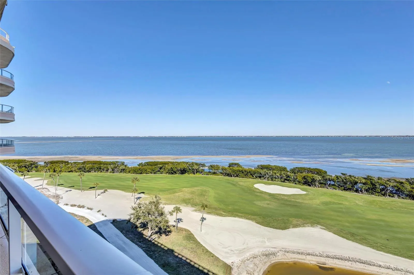 Views northeasterly across the 17th Fairway of the Bay Isles  Harborside  golf course. Sweeping Bay views across two counties.