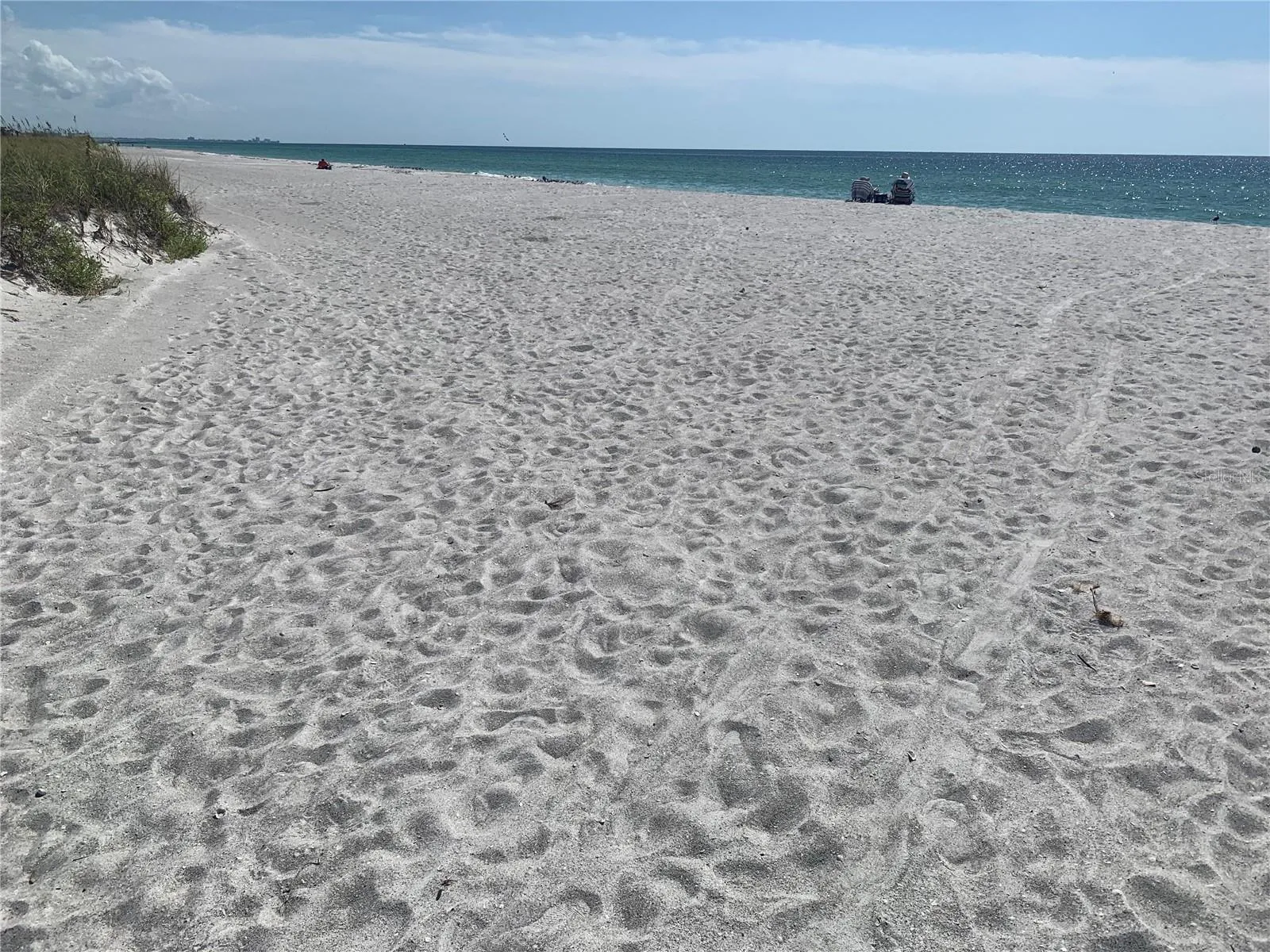 Spectacular Beach at the Bay Isles Beach Club. White sugary sand and Azure blue seas soak up the afternoon sun.