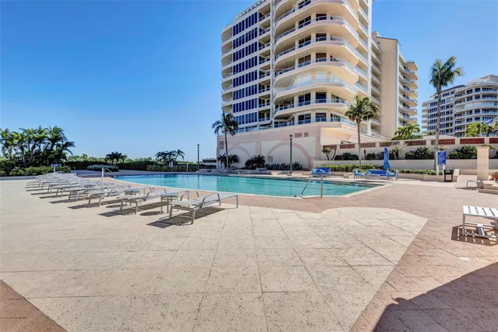 Grand Bay Swimming Pool Area and Barbecue. New Patio Furniture, Lounge Chairs, Sofa's, Umbrellas and Barbecue Area