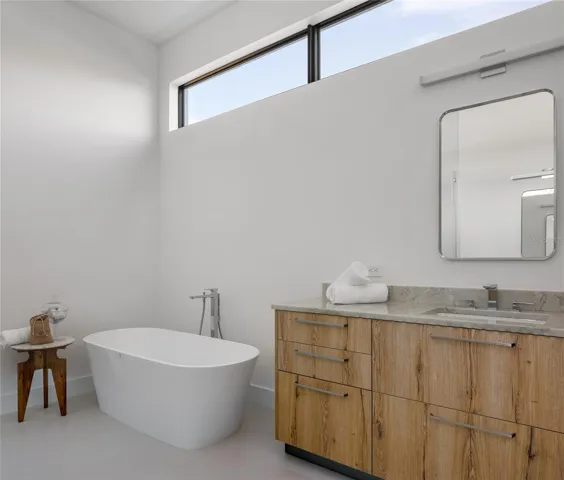 Soaking tub &amp; quartzite vanity—luxury primary bathroom
