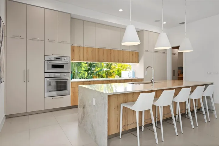 Imported Italian cabinetry with window backsplash for natural light