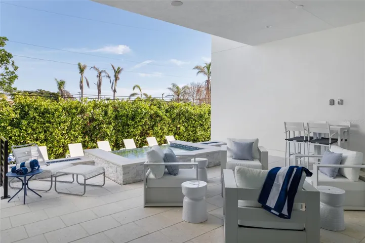 Back terrace with natural gas fire tables &amp; spa—resort-style setting