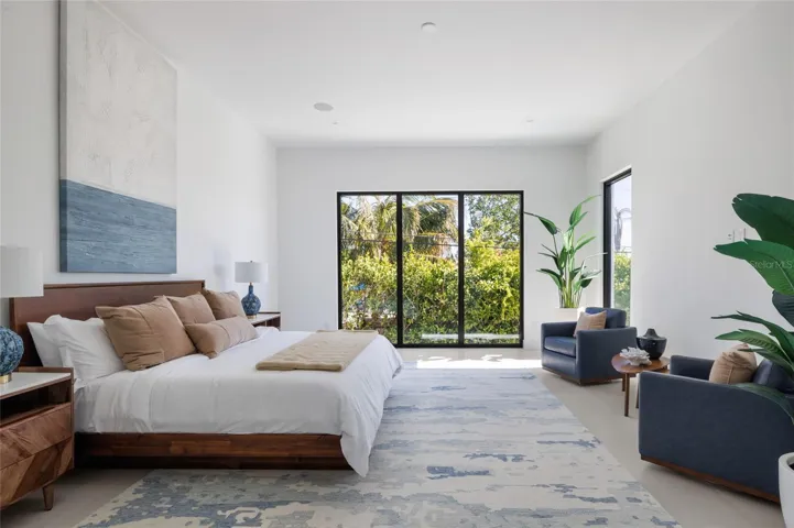 Ground-floor primary suite with direct access to outdoor terrace and duel walk in closets