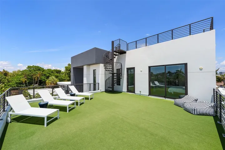Front deck with staircase to rooftop terrace