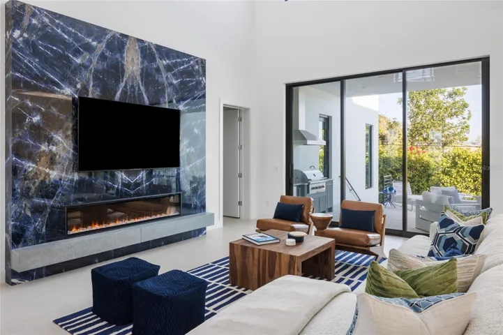 Porcelain feature wall with electric linear fireplace—statement great room