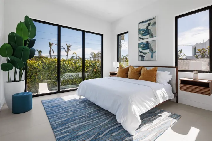 Downstairs guest suite with large impact windows &amp; natural light