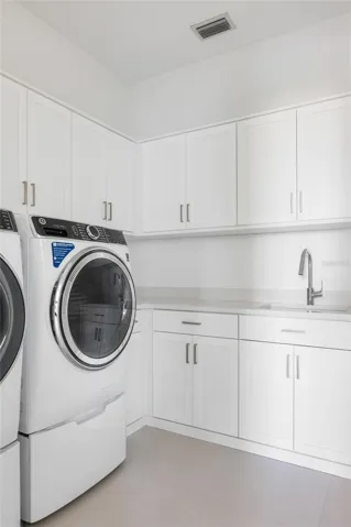 Laundry room, there is also a secondary full size washer and dryer upstairs