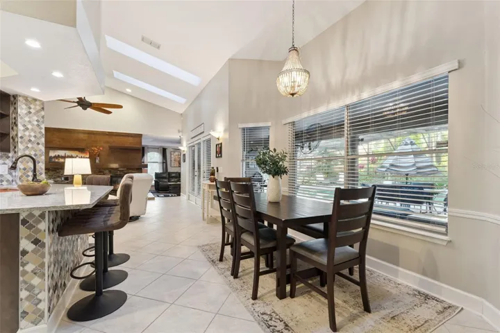 Kitchen is open to a casual dining space.