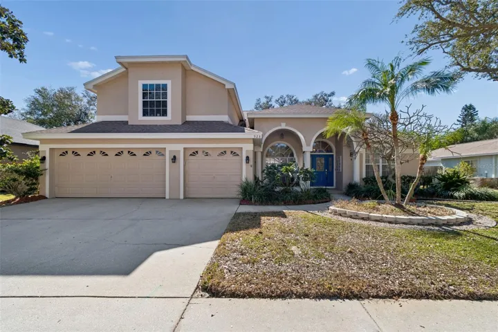 Front View: 3 Car Garage, Mature Landscaping